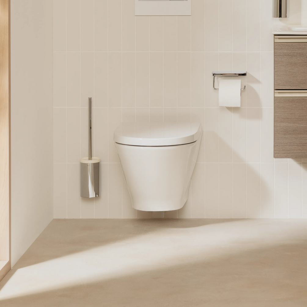 Product lifestyle image of the Roca The Gap Round Wall Hung Toilet mounted on a white bathroom wall